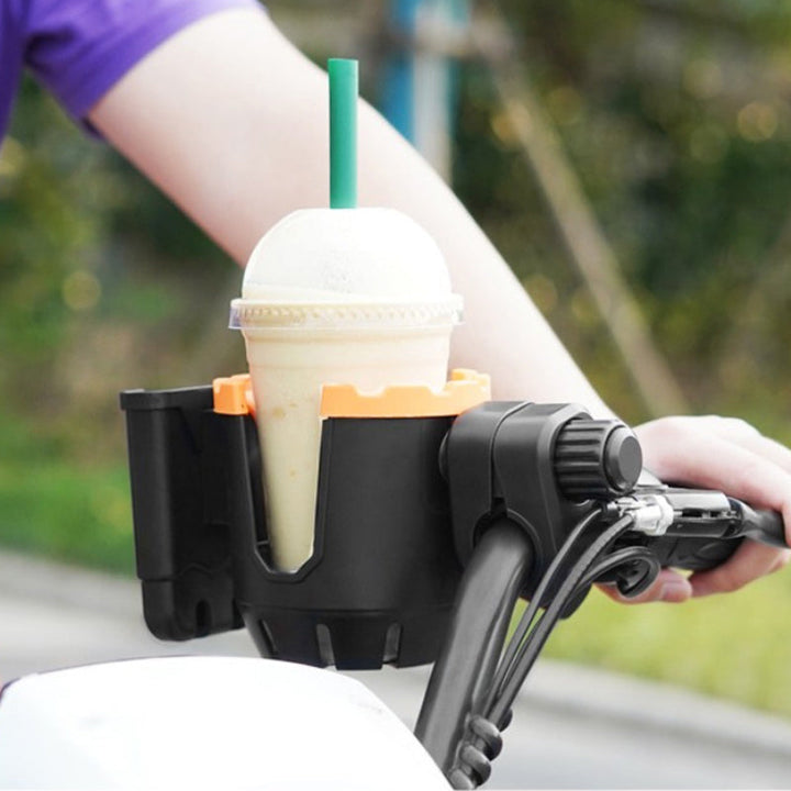 "2-i-1 dryckeshållare och telefonfäste av ABS, svart färg. Perfekt för cykel och barnvagn. Justerbar med silikonblad."