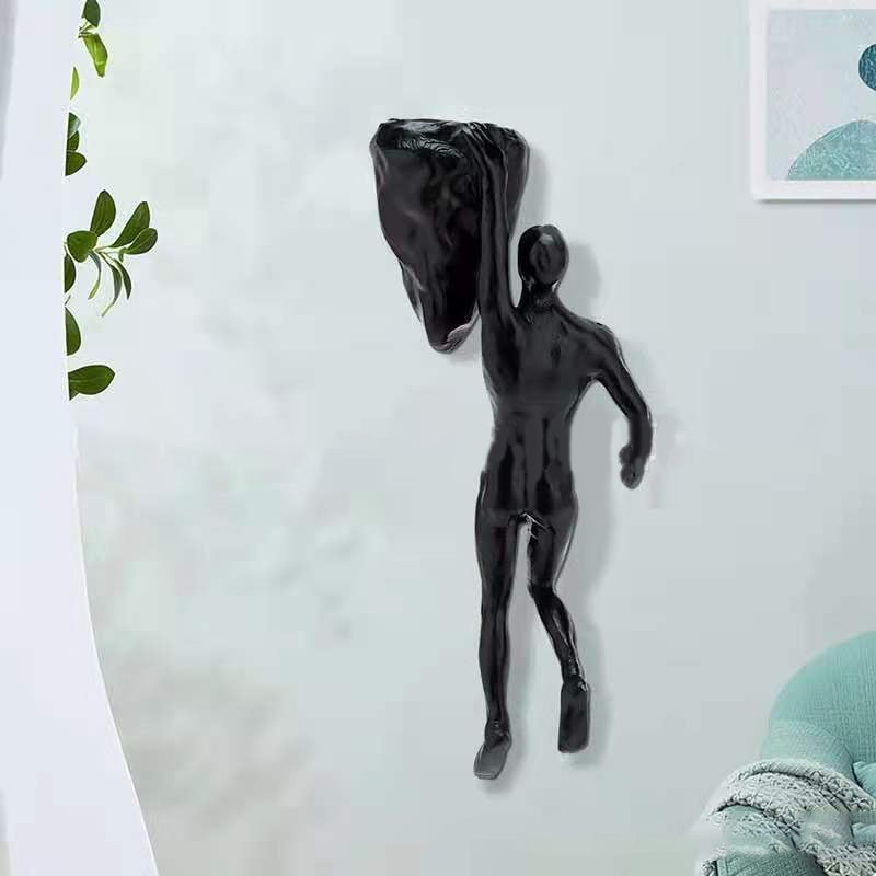 "3D svart väggklättrande staty på vit bakgrund, unik heminredning som ger dynamik och djup till väggarna."