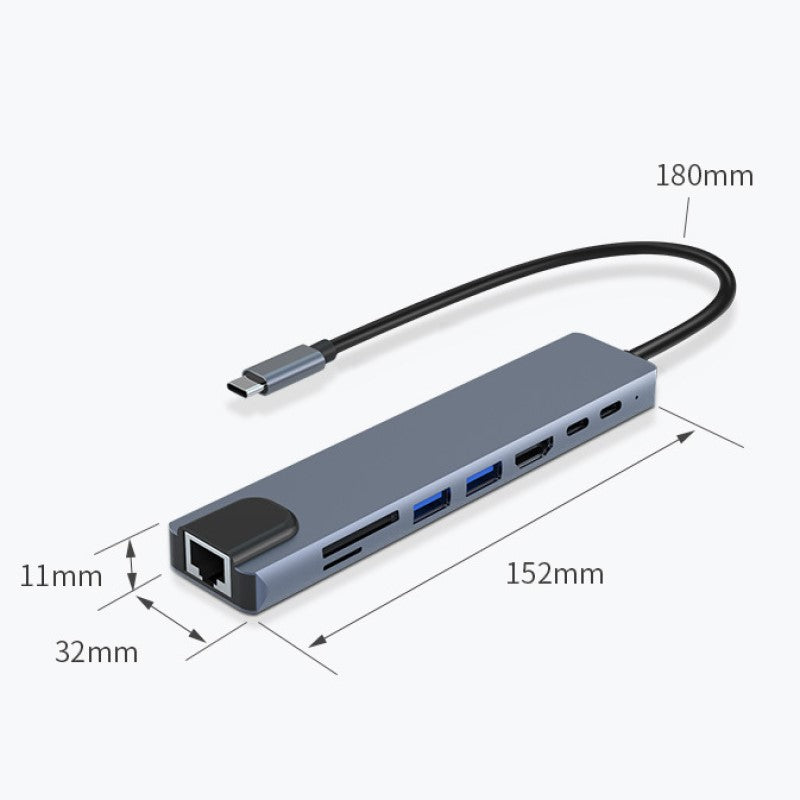 "8 i 1 USB-C dockningsstation i aluminium, modern design med flera portar för effektiv dataöverföring och laddning."