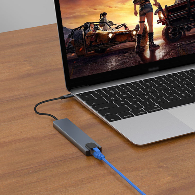 "8 i 1 USB-C dockningsstation i aluminium, modern design med flera portar för effektiv dataöverföring och laddning."