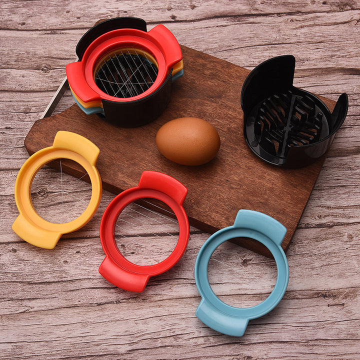 "Äggskärare i rostfritt stål och ABS, elegant design, med ergonomiskt handtag, perfekt för enkel äggskivning."
