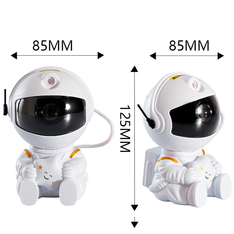 "Astronautprojektorlampa med stjärnhimmel, vit astronautfigur, projicerar 360° ljus och stjärnor i ett rum."