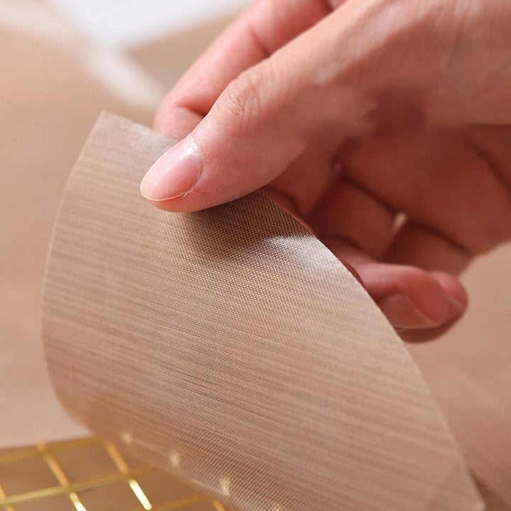 "Återanvändbar bakplåt i glasfiber med non-stick yta, hållbar och lätt att rengöra för miljövänlig bakning."