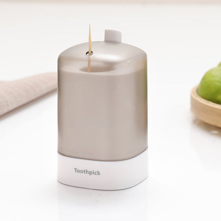 "Automatisk popup-tandpetarlåda i vit, blå, grön för köket, med modern design och praktisk funktionalitet."