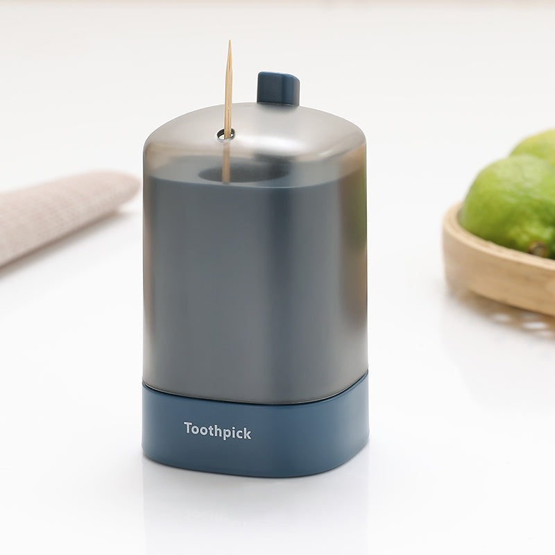 "Automatisk popup-tandpetarlåda i vit, blå, grön för köket, med modern design och praktisk funktionalitet."