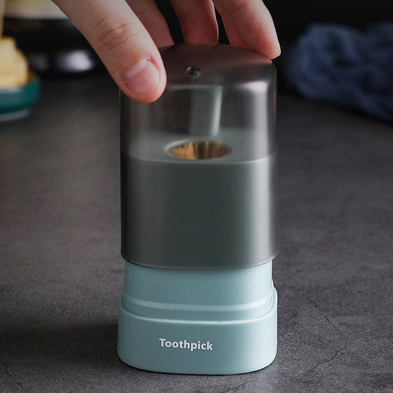 "Automatisk popup-tandpetarlåda i vit, blå, grön för köket, med modern design och praktisk funktionalitet."