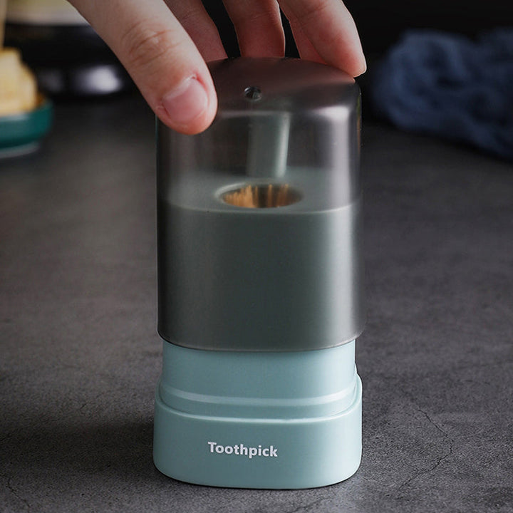 "Automatisk popup-tandpetarlåda i vit, blå, grön för köket, med modern design och praktisk funktionalitet."