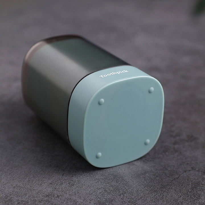 "Automatisk popup-tandpetarlåda i vit, blå, grön för köket, med modern design och praktisk funktionalitet."