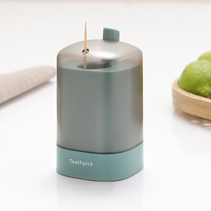 "Automatisk popup-tandpetarlåda i vit, blå, grön för köket, med modern design och praktisk funktionalitet."