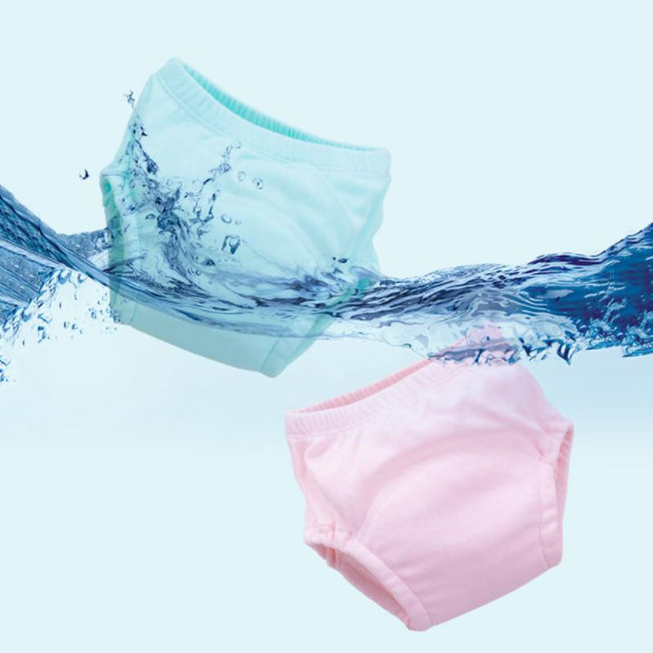 "Baby träningsbyxor i mjuk bomull med urinförhindrande design, visas i flera färger såsom gul och rosa."