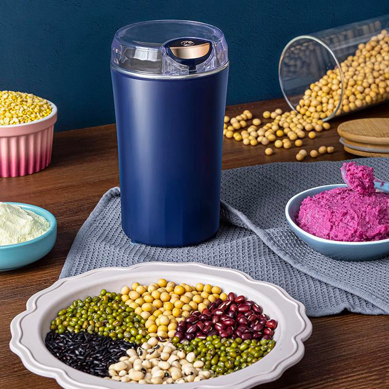 "Bärbar elektrisk kvarn i rostfritt stål, minimalistisk design, perfekt för köket, kraftfull motor, blå och vit färg."