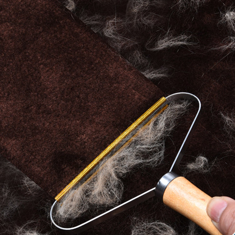 Bärbar luddborttagare för kläder och tyger, elegant och kompakt, avlägsnar ludd effektivt och batterifritt.