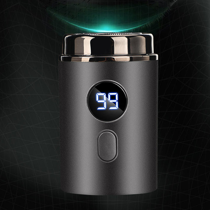 "Bärbar mini elektrisk rakapparat, kompakt design, ergonomiska konturer, idealisk för resor och daglig rakning."