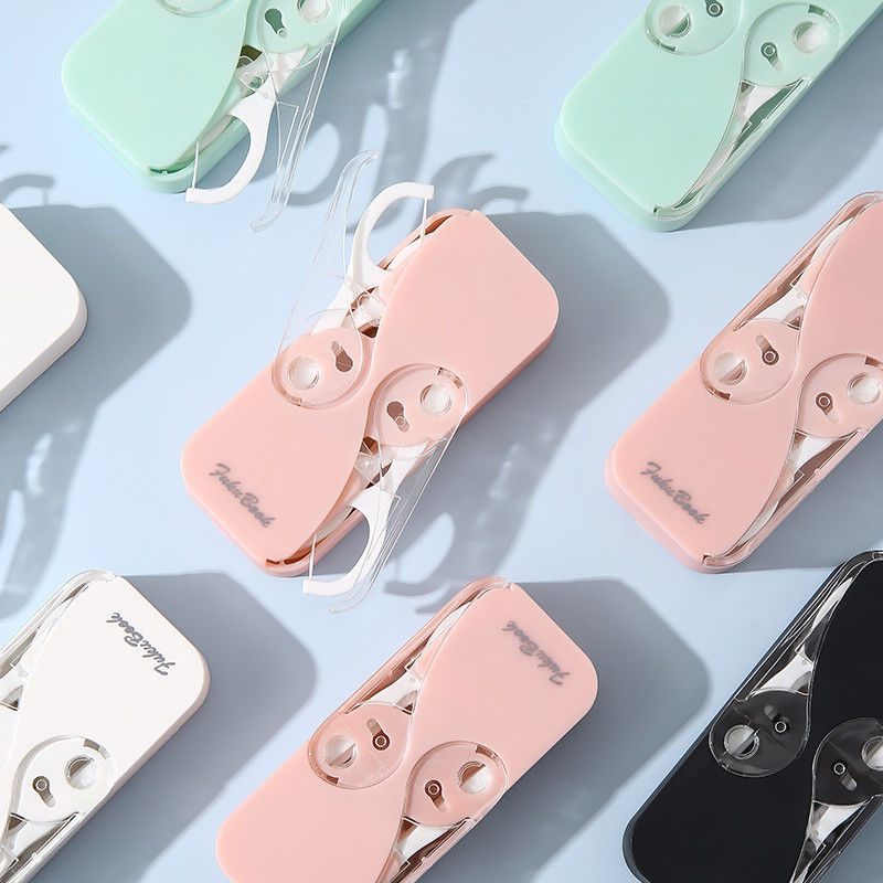 "Bärbar multifärgad tandtrådsdispenser, kompakt design i flera färger, idealisk för reser och dagligt bruk."