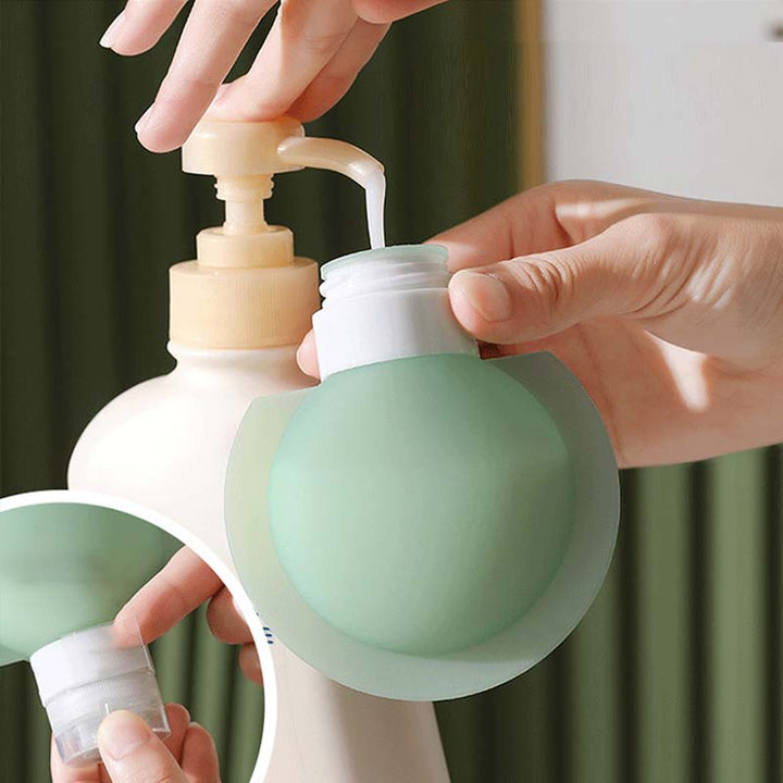 "Bärbar silikonflaska för resor med stor öppning, lätt att fylla. Perfekt accessoar för schampo och lotion på resan."