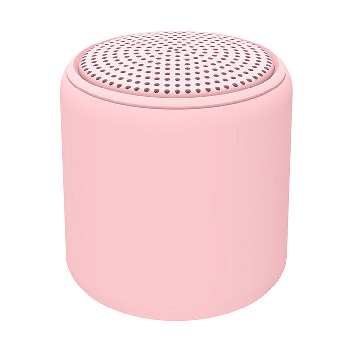 "Bärbar trådlös Bluetooth-högtalare i macaroon-färg med modern design, kompakt och lätt, perfekt för resor och hemmet."