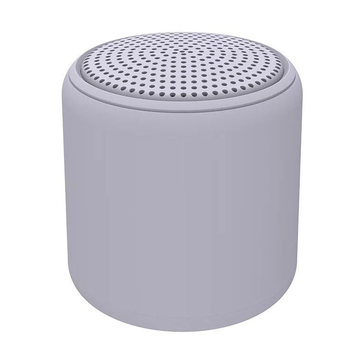 "Bärbar trådlös Bluetooth-högtalare i macaroon-färg med modern design, kompakt och lätt, perfekt för resor och hemmet."