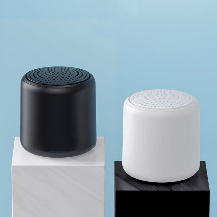 "Bärbar trådlös Bluetooth-högtalare i macaroon-färg med modern design, kompakt och lätt, perfekt för resor och hemmet."