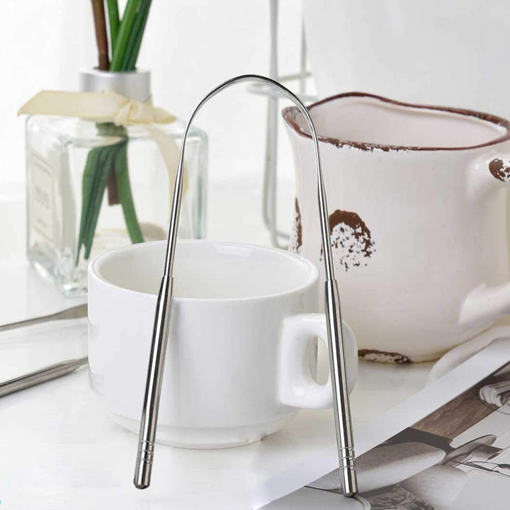 "Bärbar tungskrapa i rostfritt stål för munhygien, elegant design, effektiv, hållbar, lätt att använda."