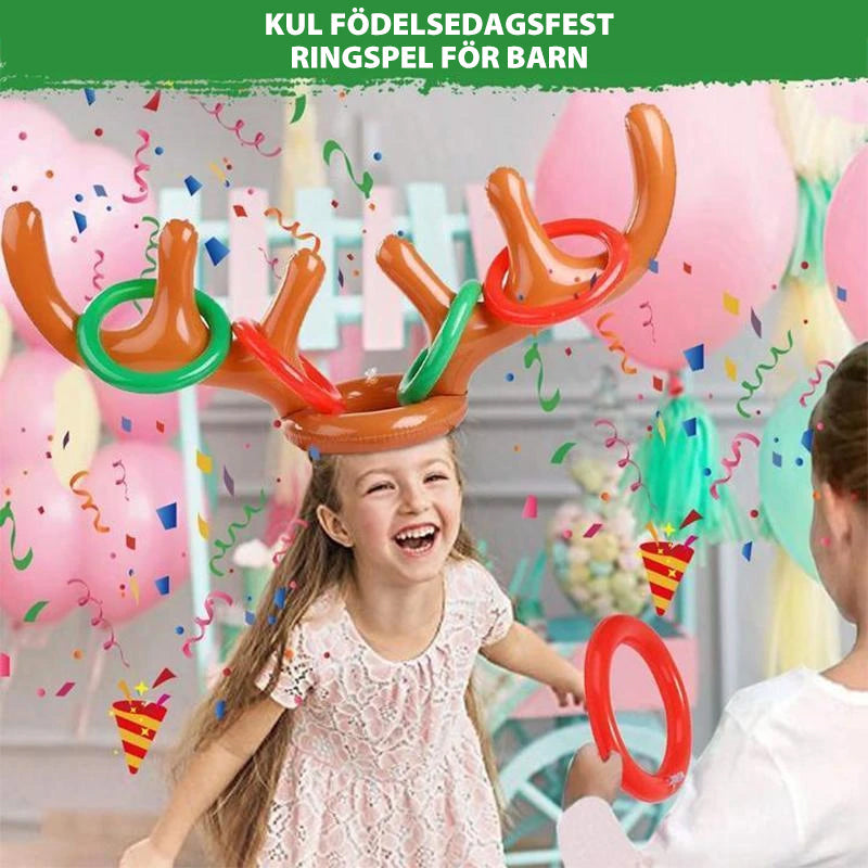 "Barn uppblåsbart ringkastningsspel med färgglada renhorn och kastringar för festlig jullek, perfekt för familjer."