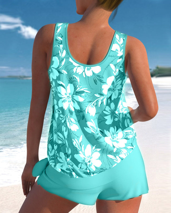 Blommigt dam tankini set med ärmlöst linne och shorts, perfekt för stranden, kombinerar stil och komfort.