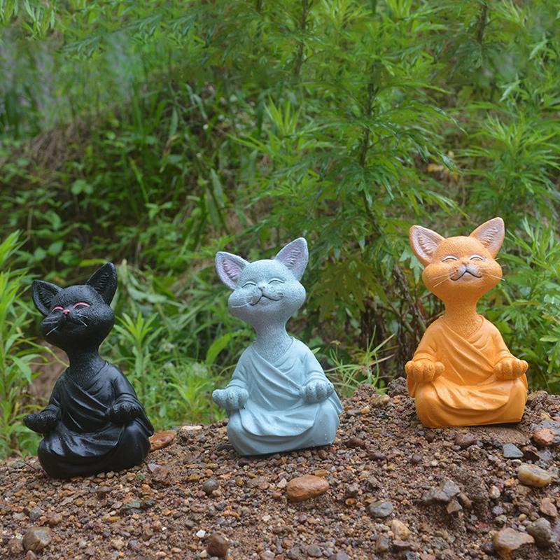 "Buddha prydnadskatt i harts, Zen dekoration med elegant design i svart, grå eller orange för hemmet."