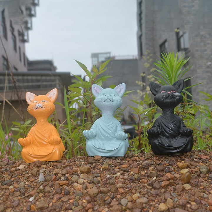 "Buddha prydnadskatt i harts, Zen dekoration med elegant design i svart, grå eller orange för hemmet."