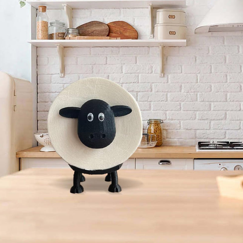 "Charmig toalettpappershållare som ett får, perfekt för att tillföra unik stil i badrummet. Modern och praktisk design."