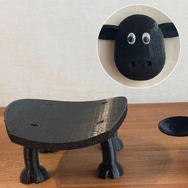 "Charmig toalettpappershållare som ett får, perfekt för att tillföra unik stil i badrummet. Modern och praktisk design."