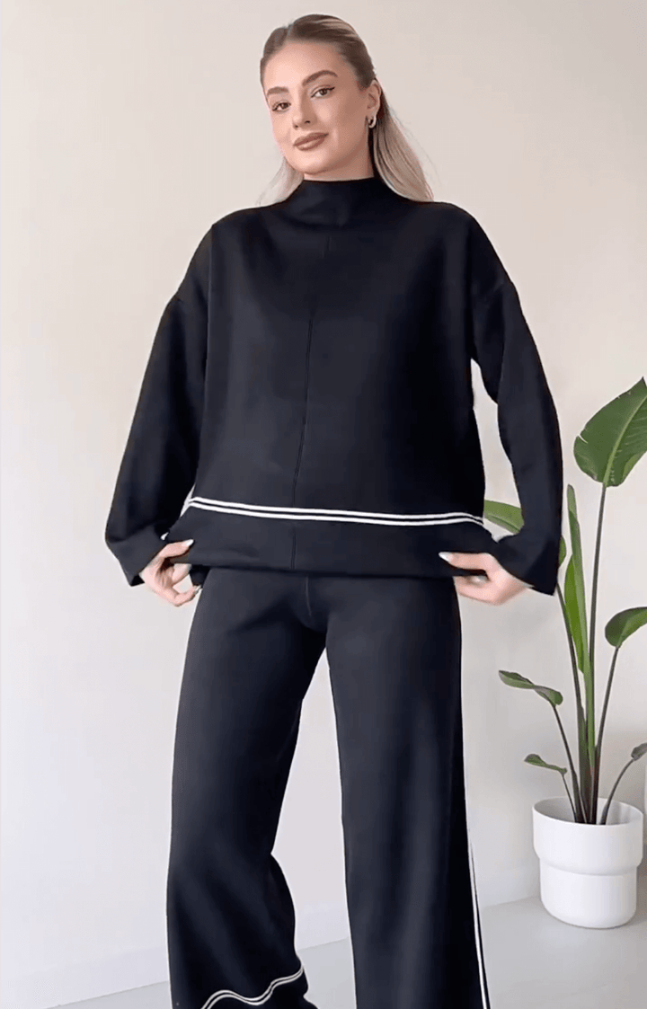 "Chic loungseset för kvinnor med vid byxa och oversized topp i mjukt, andningsbart tyg. Stilrent och bekvämt."