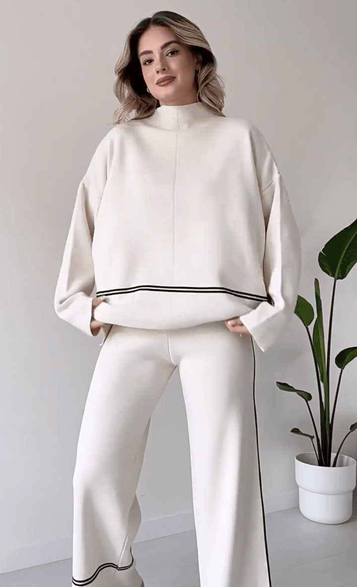 "Chic loungseset för kvinnor med vid byxa och oversized topp i mjukt, andningsbart tyg. Stilrent och bekvämt."