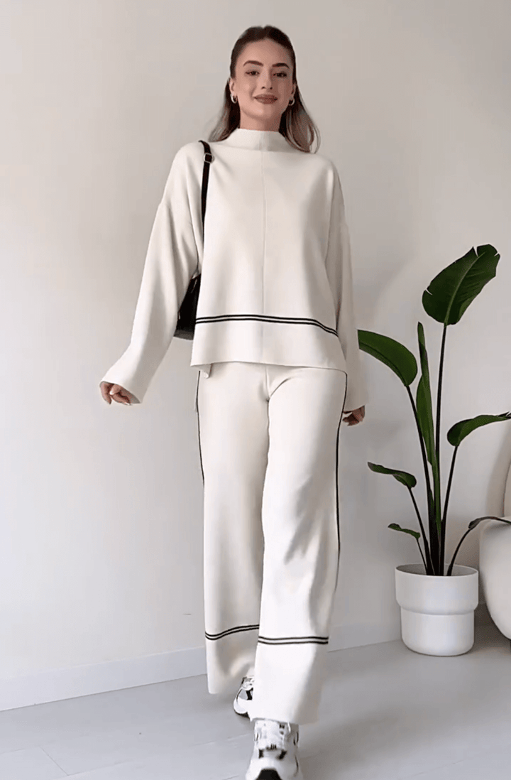 "Chic loungseset för kvinnor med vid byxa och oversized topp i mjukt, andningsbart tyg. Stilrent och bekvämt."