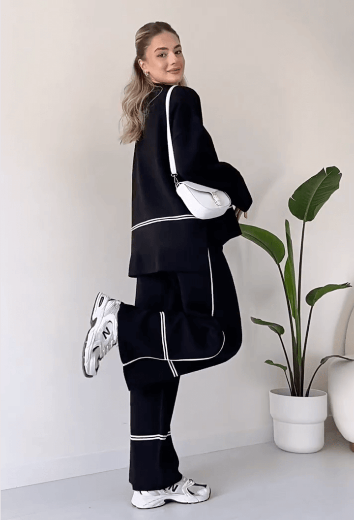 "Chic loungseset för kvinnor med vid byxa och oversized topp i mjukt, andningsbart tyg. Stilrent och bekvämt."
