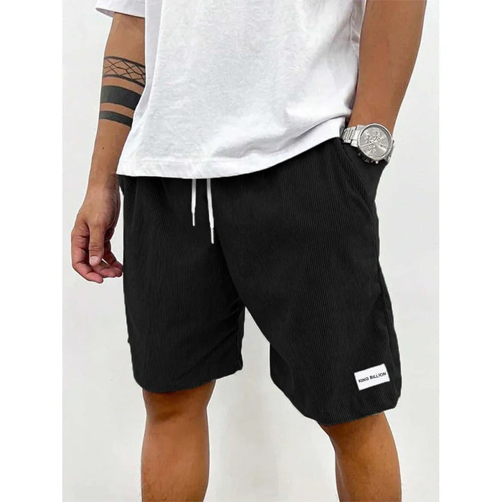 Corduroy shorts för herrar i mjuk struktur, avslappnad passform, beige färg, med praktiska fickor för vardaglig stil.