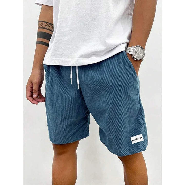 Corduroy shorts för herrar i mjuk struktur, avslappnad passform, beige färg, med praktiska fickor för vardaglig stil.