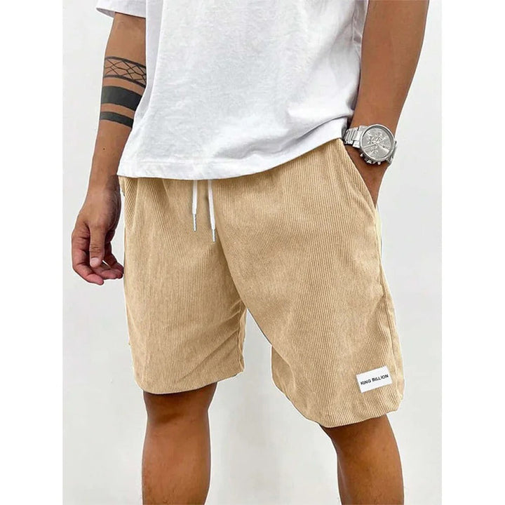 Corduroy shorts för herrar i mjuk struktur, avslappnad passform, beige färg, med praktiska fickor för vardaglig stil.