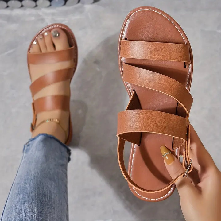 "Dahlia romerska sandaler med justerbar ankell rem, flera färger. Stilig och komfortabel design för kvinnor."
