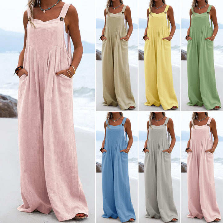 "Damer enfärgad overall med breda ben i polyester, elastisk och stilren design i flera färger, ideal för olika tillfällen."