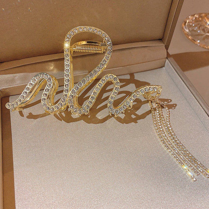 "Damhårklämmor i strassmetall, guld och silver, elegant design, perfekt för stil och elegans, kvinnliga accessoarer."