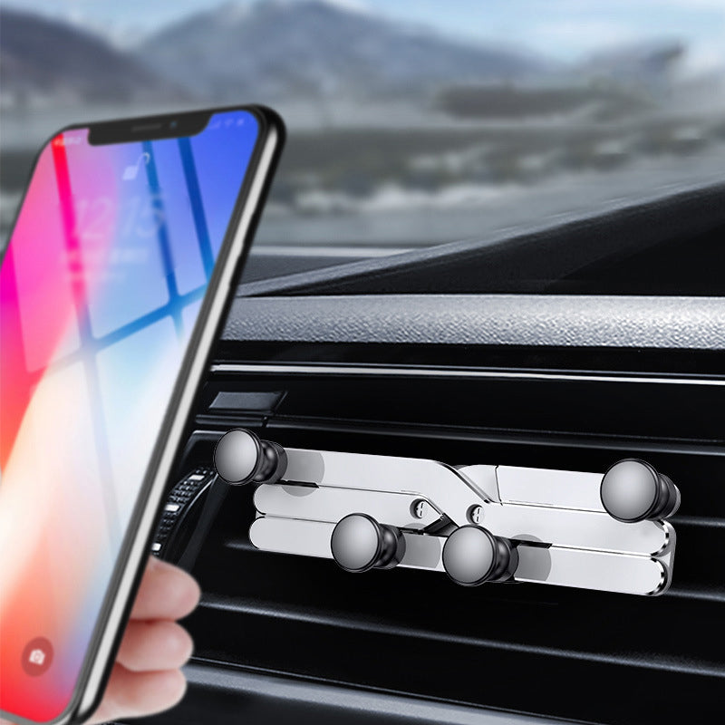 "Deformerande biltelefonhållare i svart, monterad i bilventilation, visar 360° rotation för enkel justering och sikt."