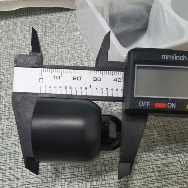 "Diskret svart mini WiFi-kamera för hemövervakning, 1080P HD, elegant design, mörkerseende och rörelsedetektion."