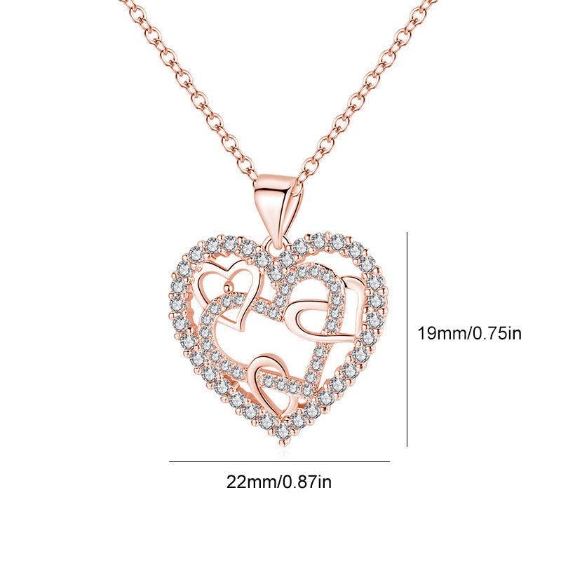 Dubbelhjärta halsband med gnistrande CZ-stenar, sammanlänkade hjärtan i roséguld och silver mot vit bakgrund.