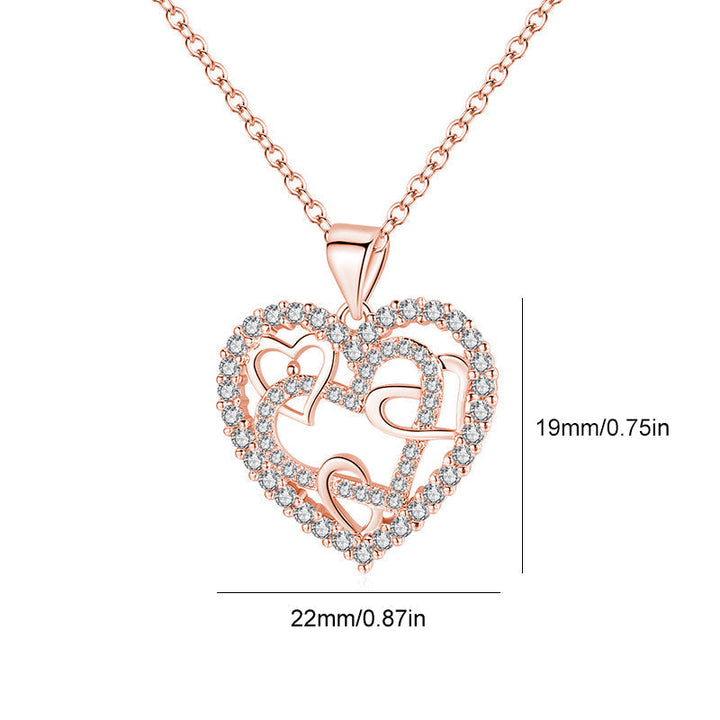 Dubbelhjärta halsband med gnistrande CZ-stenar, sammanlänkade hjärtan i roséguld och silver mot vit bakgrund.