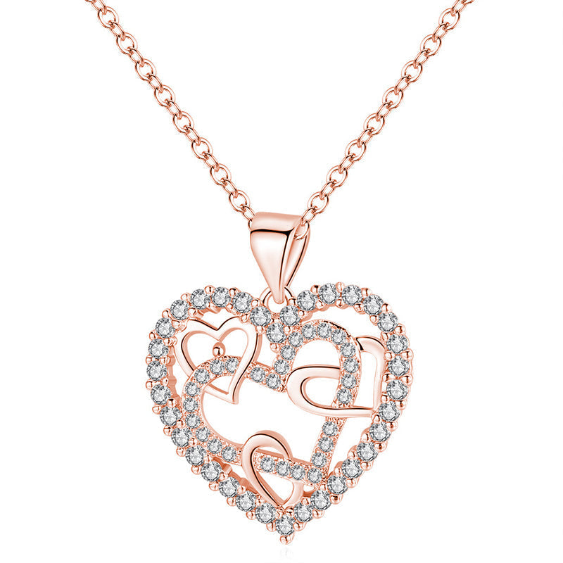 Dubbelhjärta halsband med gnistrande CZ-stenar, sammanlänkade hjärtan i roséguld och silver mot vit bakgrund.