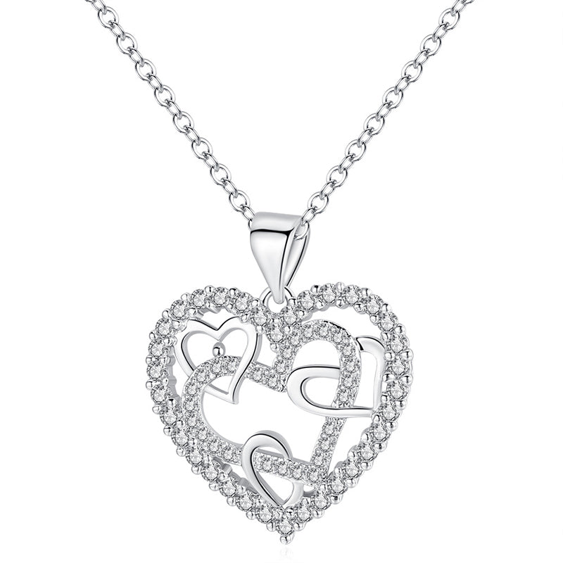 Dubbelhjärta halsband med gnistrande CZ-stenar, sammanlänkade hjärtan i roséguld och silver mot vit bakgrund.