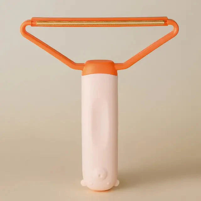 "Dubbelsidig luddskrapa i grön, ergonomisk design, effektiv för kläder, möbler och mattor, med mångsidig funktion."