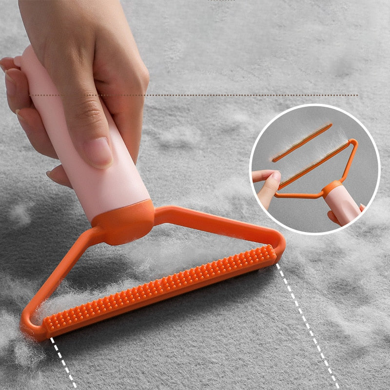 "Dubbelsidig luddskrapa i grön, ergonomisk design, effektiv för kläder, möbler och mattor, med mångsidig funktion."