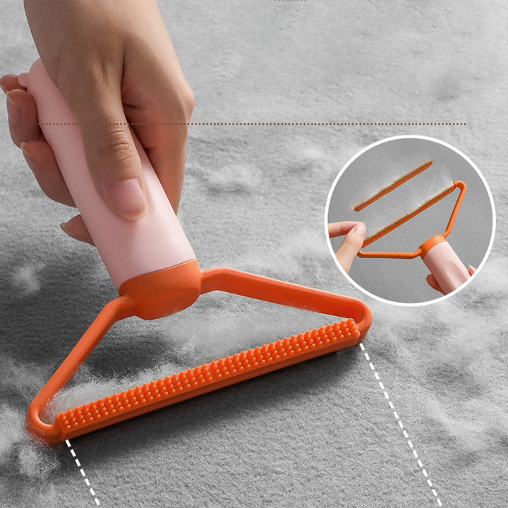 "Dubbelsidig luddskrapa i grön, ergonomisk design, effektiv för kläder, möbler och mattor, med mångsidig funktion."