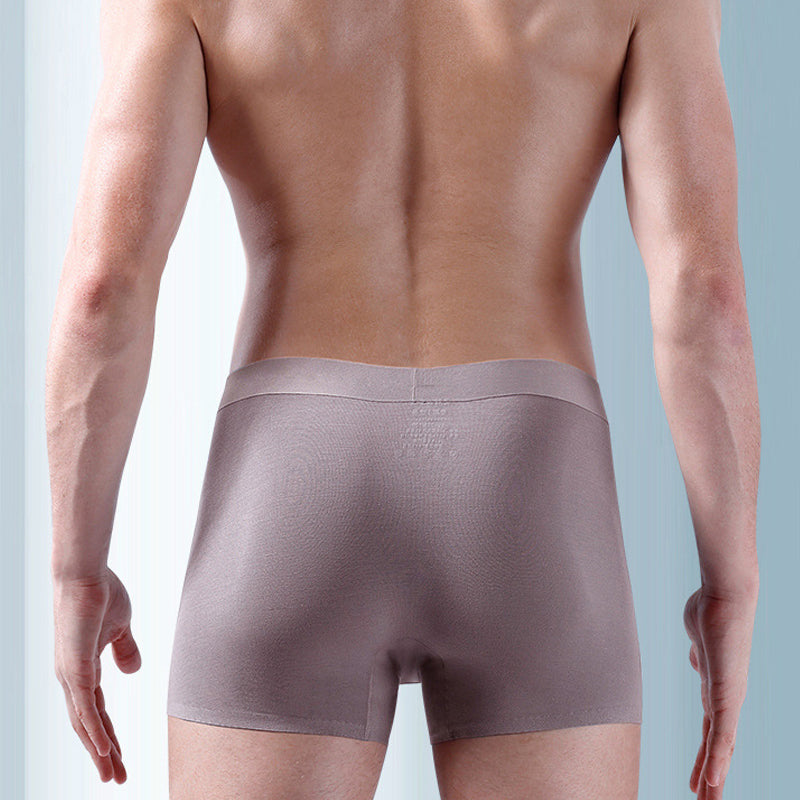 "Ekologiska bomullsboxershorts för män i svart, grå och blå, med stödpaneler för komfort och modern stil."