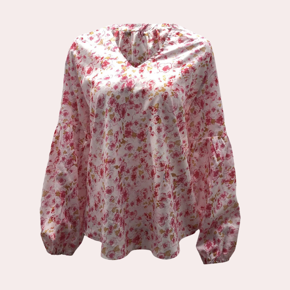 "Elegant blommig blus i lätt och mjukt material med avslappnad passform, perfekt för både vardag och kontor."